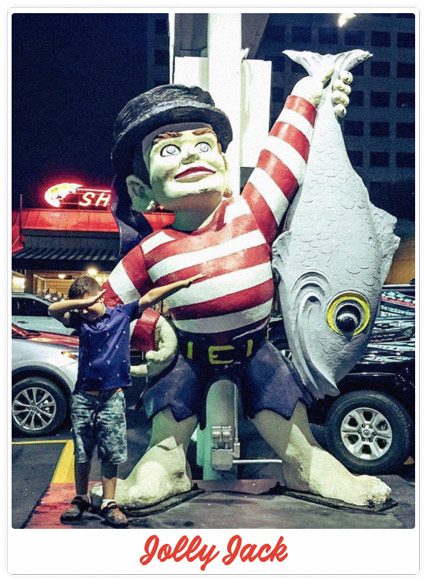 Young child taking a selfie at Sea Island Shrimp House with Jolly Jack