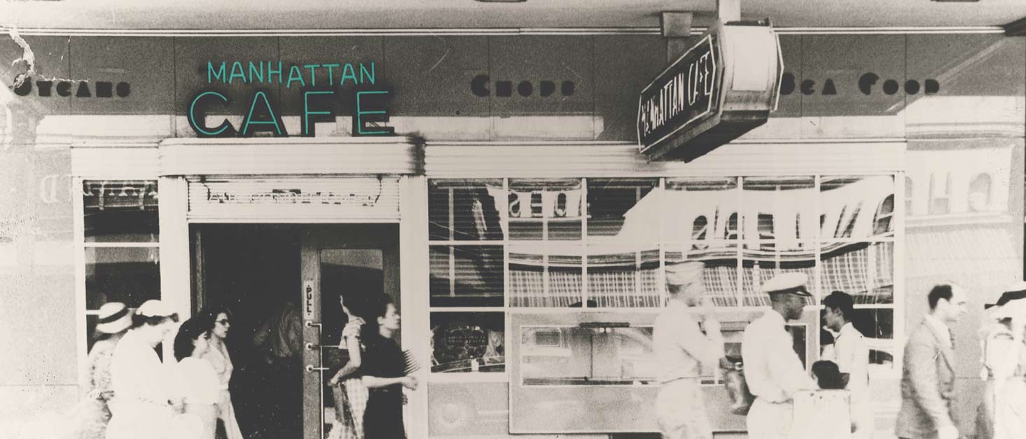 A black and white photo of Manhattan Café, the original resturant started by the Anthony family before Sea Island